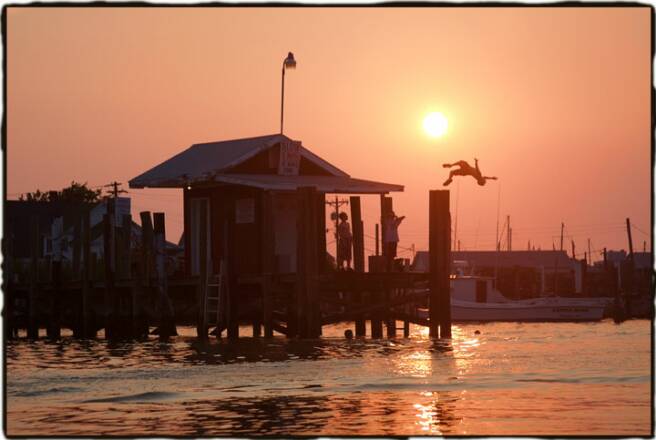 Back flip off pilings at Tangier Island