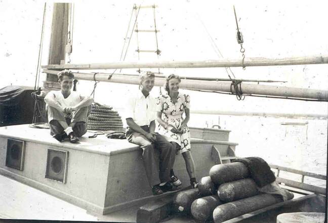 Merrill Byrd, J.C. Drewer and Juanita on buyboat J.C. Drewer