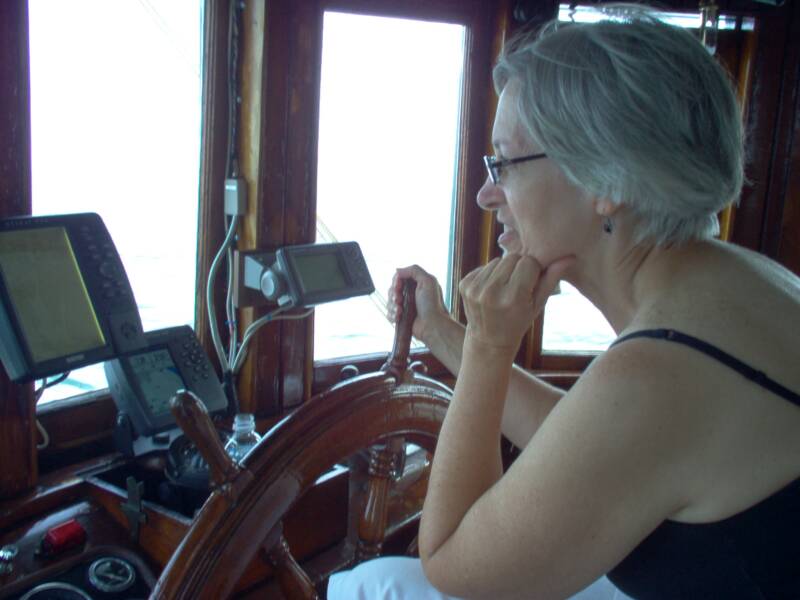 Brenda at helm of buyboat.jpg